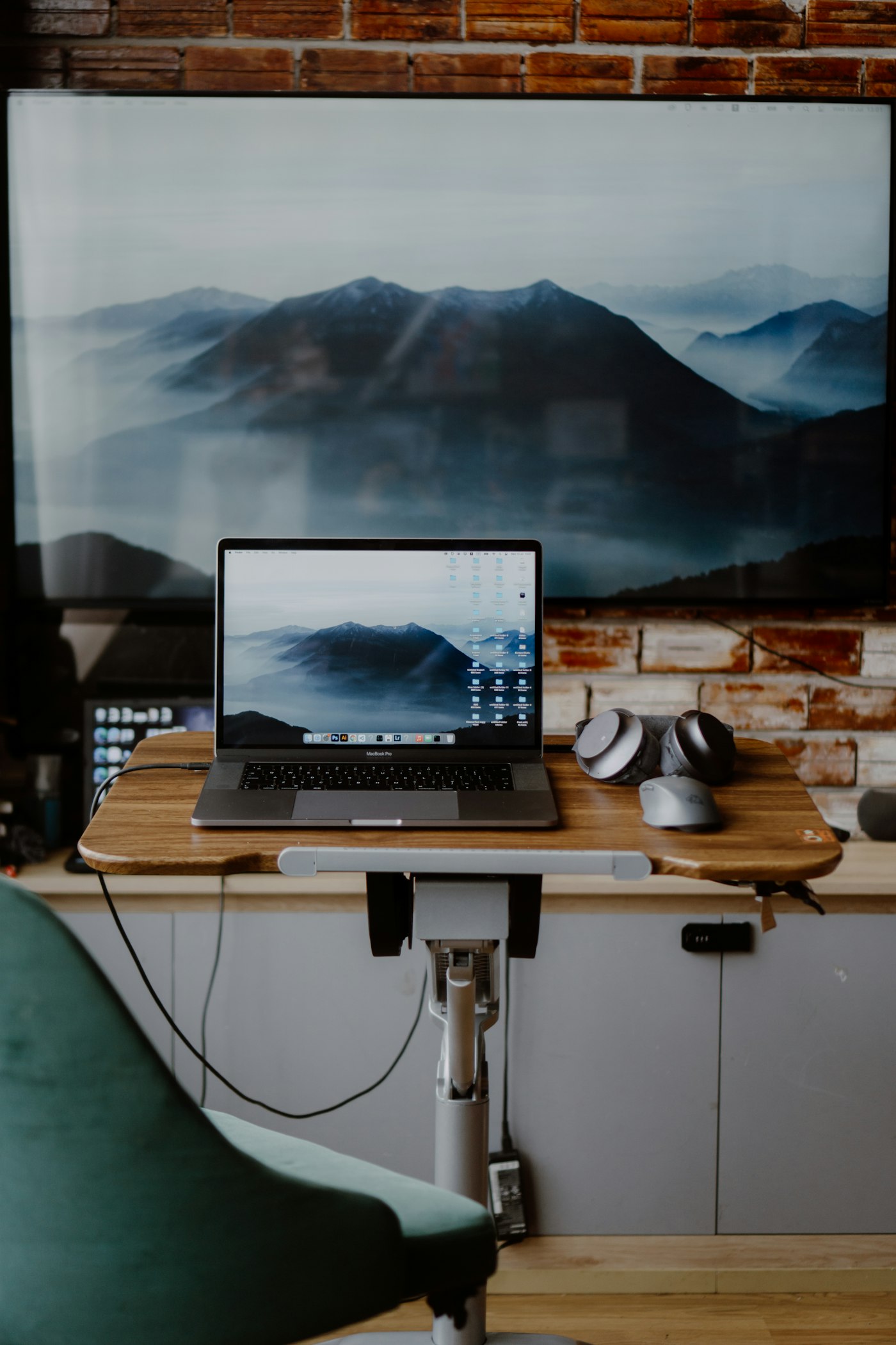 A clean workspace with a laptop and desk setup ready for online support work